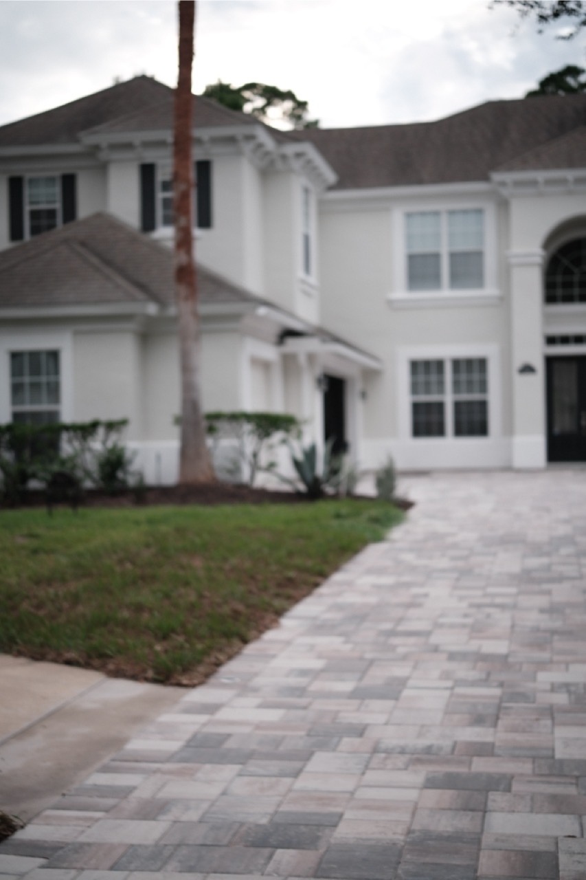 Paver driveway outside a home